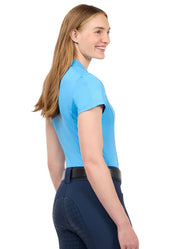 Woman wearing a bright blue short sleeve polo shirt, side view