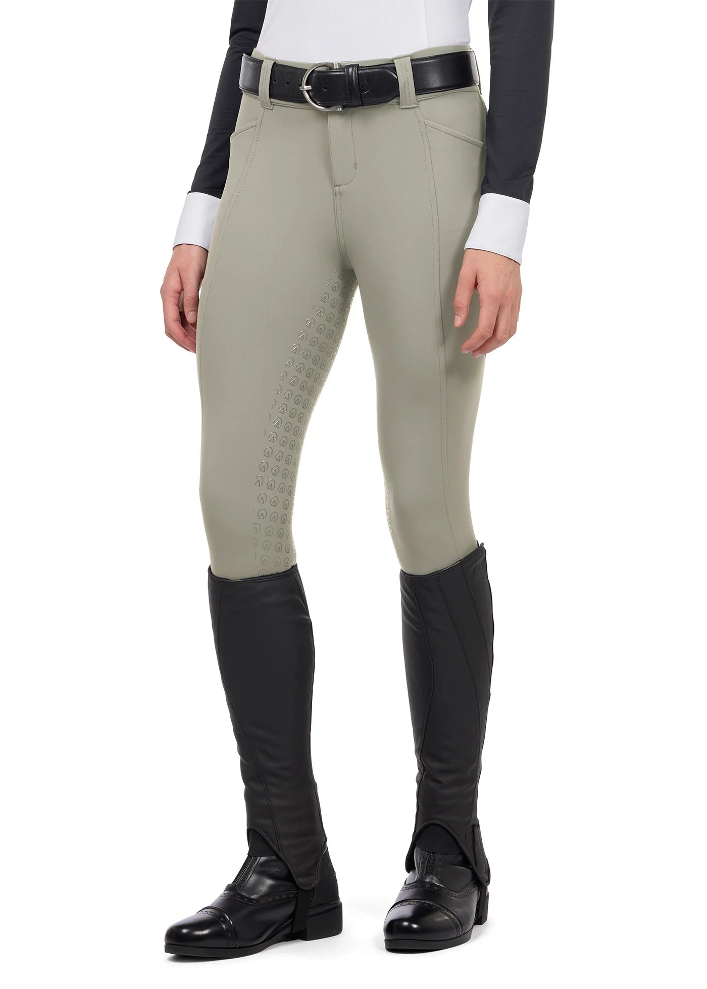 Front view of a model wearing the tan Kerrits Affinity Pro Full Seat Breech on a white background