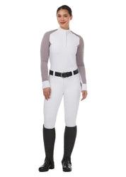 Full body front view of a model wearing the white Kerrits Affinity Pro Full Seat Breech and white/purple show top in front of a white background
