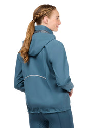 Woman wearing a teal waterproof jacket, rear view