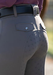 Close-up of back pocket on gray breeches