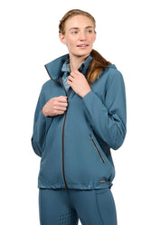 Woman wearing a teal waterproof jacket, front view