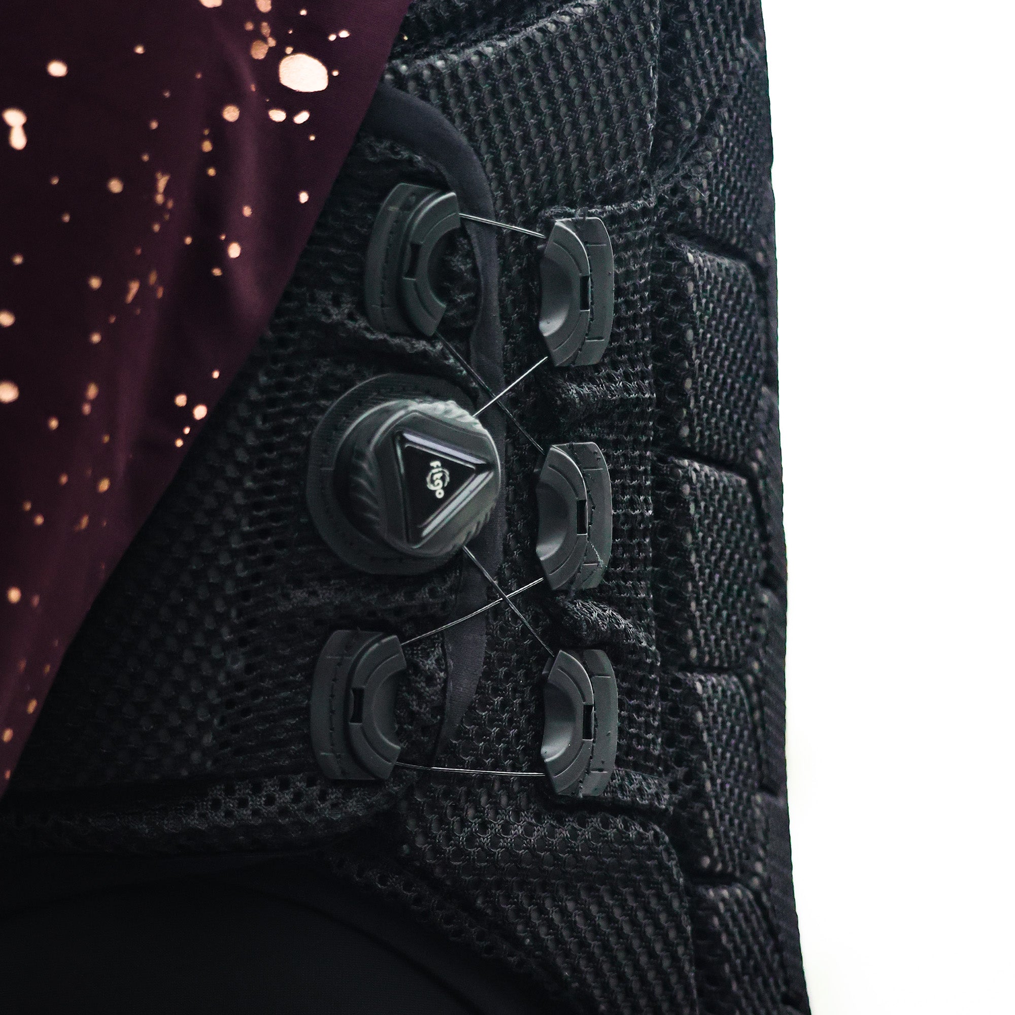 Close-up view of the side adjustment on the Front view of the Evoke Hex6 Body Protector