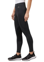 Side view of a model wearing the black Kerrits Performance Knee Patch Pocket Tight on a white background