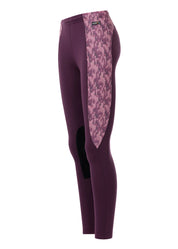 Side view of the purple Kerrits Kids Performance Knee Patch Riding Tight on a white background