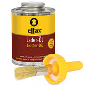 Front view of a can of Effax Leather Oil with the brush in front of it on a white background