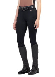 Front view of a model wearing the black Kerrits Coolcore Full Leg Tech Tight on a white background