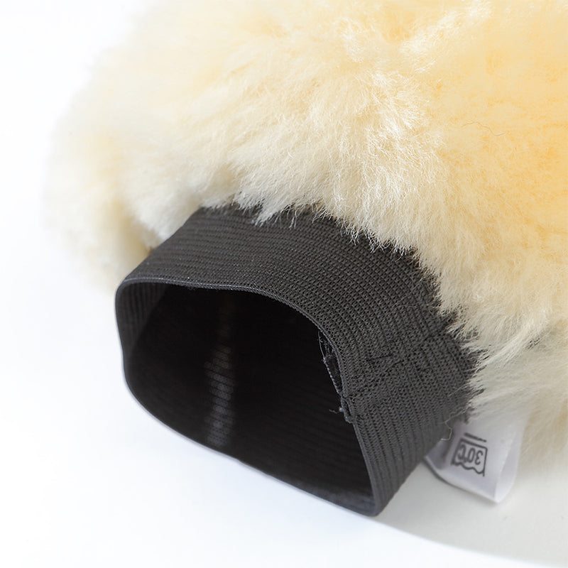 Close-up view of the elastic wristband on the Kavalkade Lambskin Grooming Glove on a white background