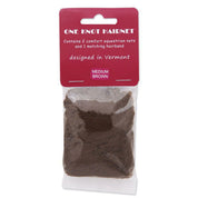 Front view of a package of 2 medium brown One Knot Hair Nets on a white background