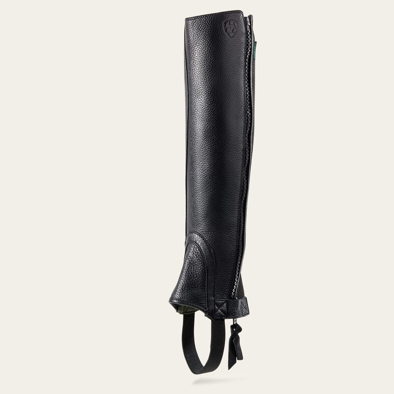 Angled side view of the black Ariat Breeze Half Chap on a plain background