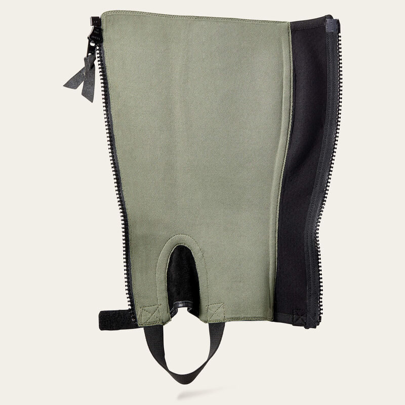 Flat interior view of the black Ariat Breeze Half Chap on a plain background