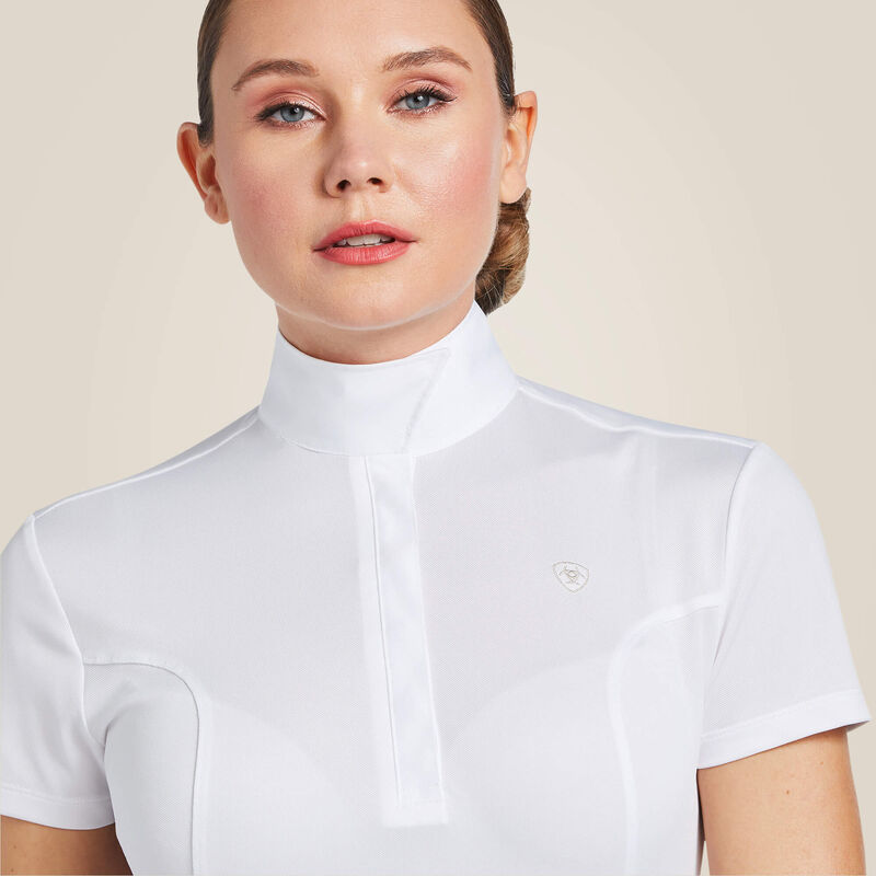 Close-up front view of a female model wearing the white Ariat Aptos Short Sleeve Show Shirt on a plain background