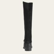 Ariat Scout Half Chap in black worn over paddock boot, showing rear panel and zipper closure