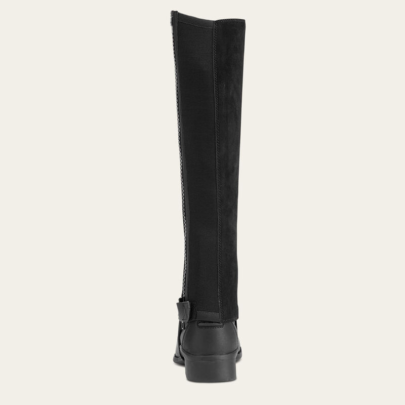 Ariat Scout Half Chap in black worn over paddock boot, showing rear panel and zipper closure