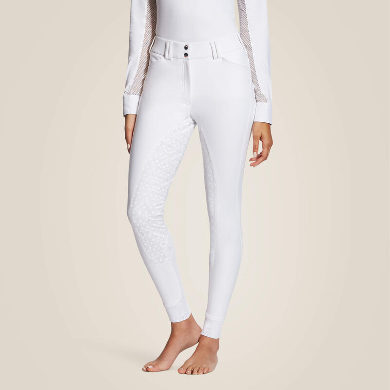 Front view of a model wearing the white Ariat Tri Factor Grip Full Seat Breech on a plain background