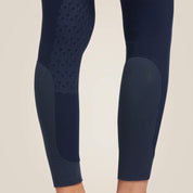 Close-up back view of the lower legs on the navy Ariat Tri Factor Grip Knee Patch Breech on a plain background