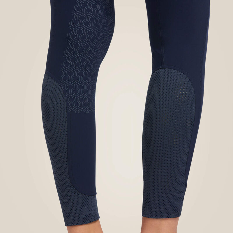Close-up back view of the lower legs on the navy Ariat Tri Factor Grip Knee Patch Breech on a plain background