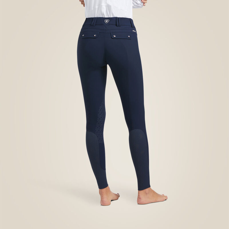 Back view of a model wearing the navy Ariat Tri Factor Grip Knee Patch Breech on a plain background