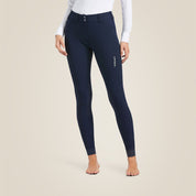 Front view of a model wearing the navy Ariat Tri Factor Grip Knee Patch Breech on a plain background