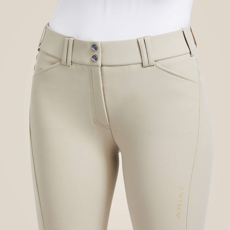 Close-up front view of the tan Ariat Tri Factor Grip Knee Patch Breech on a plain background