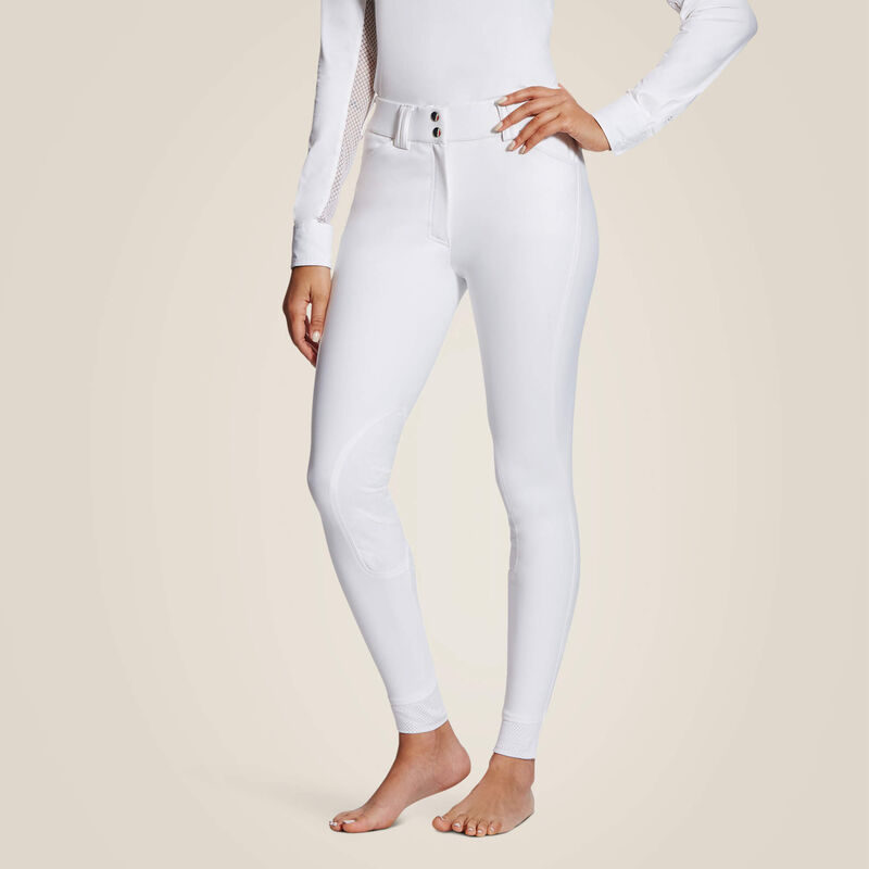 Front view of a model wearing the white Ariat Tri Factor Grip Knee Patch Breech on a plain background