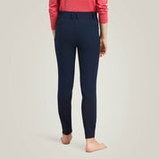 Back view of young model wearing the Ariat Youth Prelude Knee Patch Breeches in navy in a studio setting