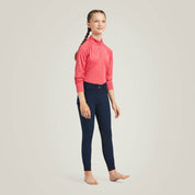 Full body front view of young model wearing the Ariat Youth Prelude Knee Patch Breeches in navy in a studio setting