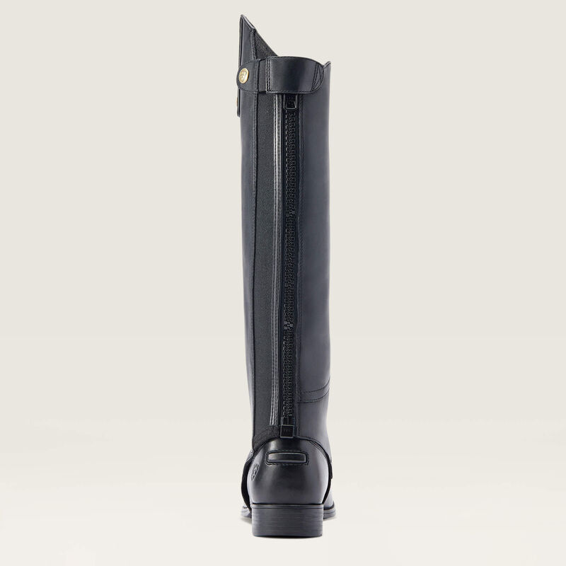 Back view of the black Ariat Heritage Contour Half Chap over a paddock boot