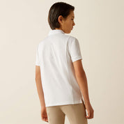 Back view of a young model wearing the Ariat Youth Tek Short Sleeve Show Shirt in white with tan breeches in a studio setting