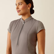 Close-up  front view of a model wearing the plum grey Ariat Breathe 1/2 Zip Baselayer on a plain background