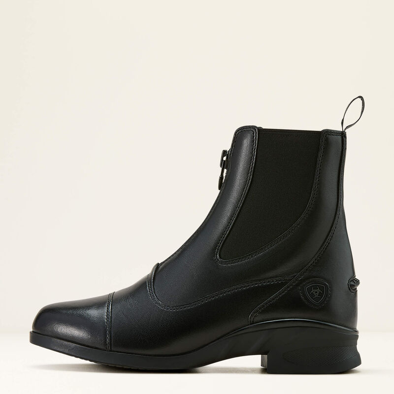 Side view of the black Ariat Heritage Zip Paddock Boot on a plain background