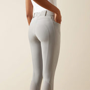 Back view of a model wearing the Ariat Tri Factor NT Full Seat Breech in gray in a studio setting