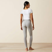 Full body back view of a model wearing the gray Ariat Tri Factor NT Full Seat Breech and a white shirt in a studio setting
