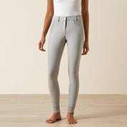 Front view of a model wearing the Ariat Tri Factor NT Full Seat Breech in gray in a studio setting