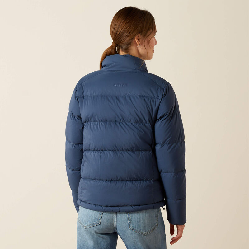 Back view of a female model wearing the Big Dipper Ariat Ultrapuff Down Jacket on a plain background
