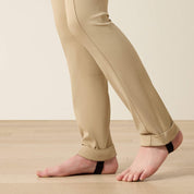 Close up view of the lower leg of the Ariat Youth Protege Jod Knee Patch Breeches in tan 