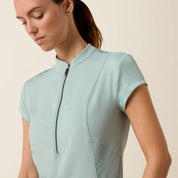 Close-up front view of a model wearing the blue surf Ariat Breathe 1/2 Zip Baselayer on a plain background