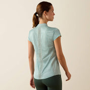 Back view of a model wearing the blue surf Ariat Breathe 1/2 Zip Baselayer on a plain background