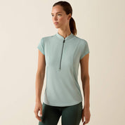 Front view of a model wearing the blue surf Ariat Breathe 1/2 Zip Baselayer on a plain background