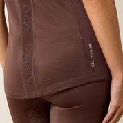 Close-up back view of a model wearing the brown Ariat Breathe 1/2 Zip Baselayer on a plain background