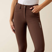 Close-up front view of a model wearing the Ariat Tri Factor NT Full Seat Breech in brown in a studio setting