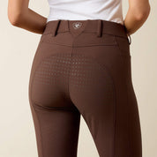 Close-up back view of a model wearing the Ariat Tri Factor NT Full Seat Breech in brown in a studio setting