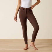 Front view of a model wearing the Ariat Tri Factor NT Full Seat Breech in brown in a studio setting