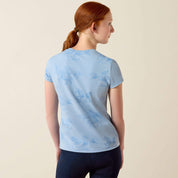 Back view of young girl wearing the Ariat Youth Mirage T-Shirt in blue in a studio setting