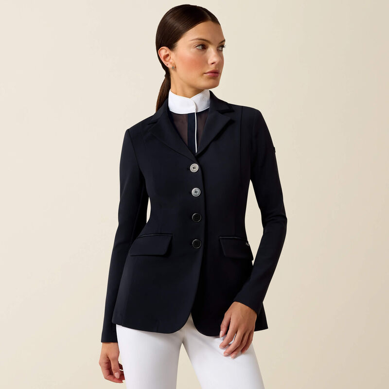 Front view of a female model wearing the Navy Eclipse Ariat Allure Show Coat on a plain background