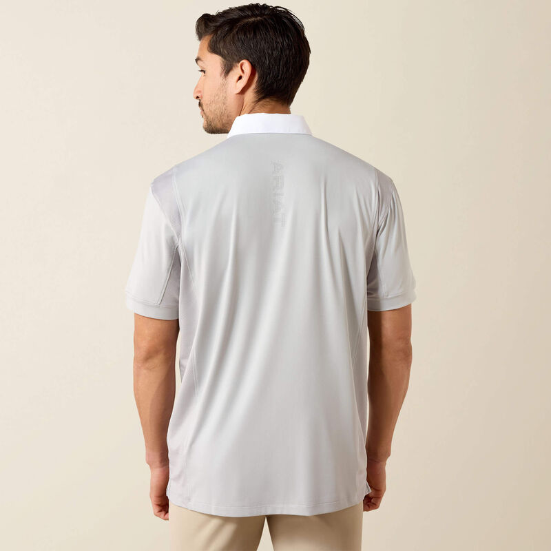 Back view of male model wearing the Ariat Mens Tek Short Sleeve Show Shirt in gray and tan breeches in a studio setting