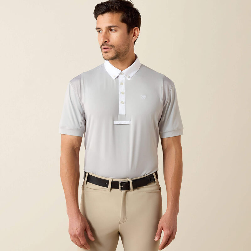 Front view of male model wearing the Ariat Mens Tek Short Sleeve Show Shirt in gray and tan breeches in a studio setting
