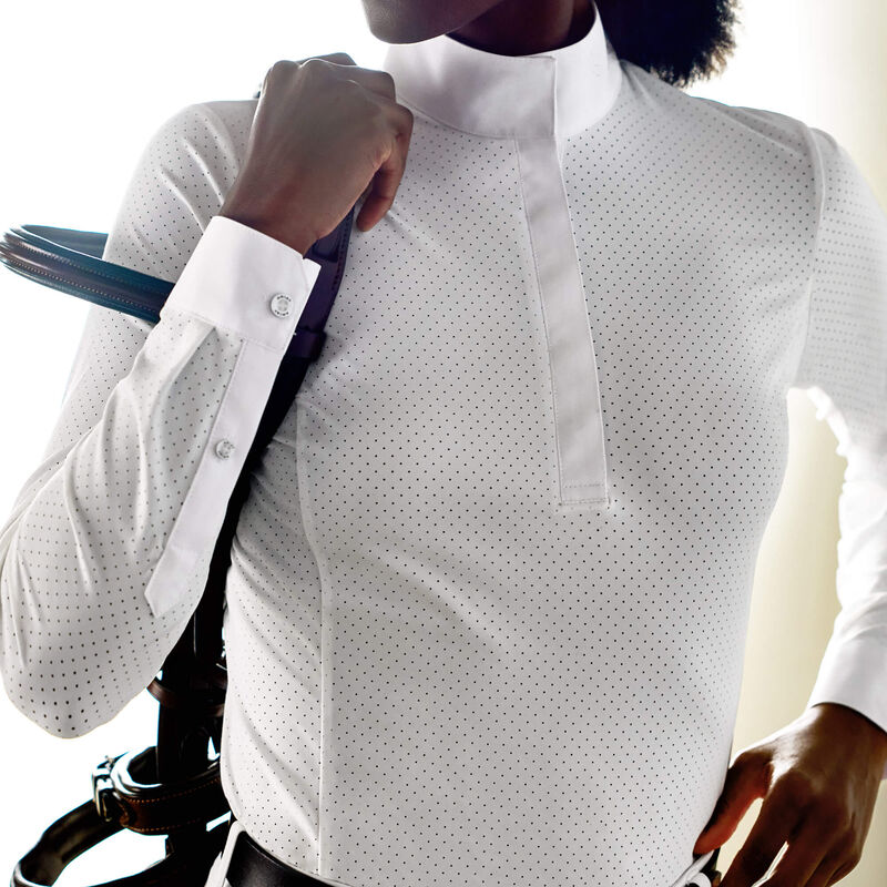 Front view of model wearing the Ariat Breathe Long Sleeve Showshirt in white with a bridle on her shoulder