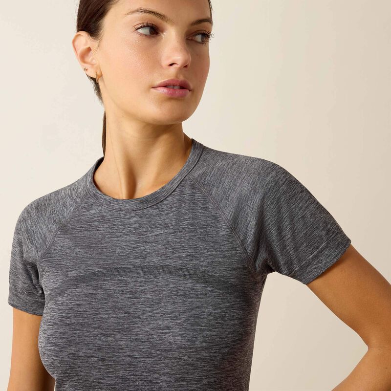 Close up front view of a model wearing the Ariat Sustain Short Sleeve Baselayer in gray in a studio