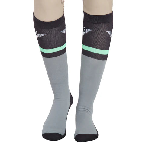 Close-up front view of a model wearing the green TuffRider Impulsion Knee Hi Socks on a white background